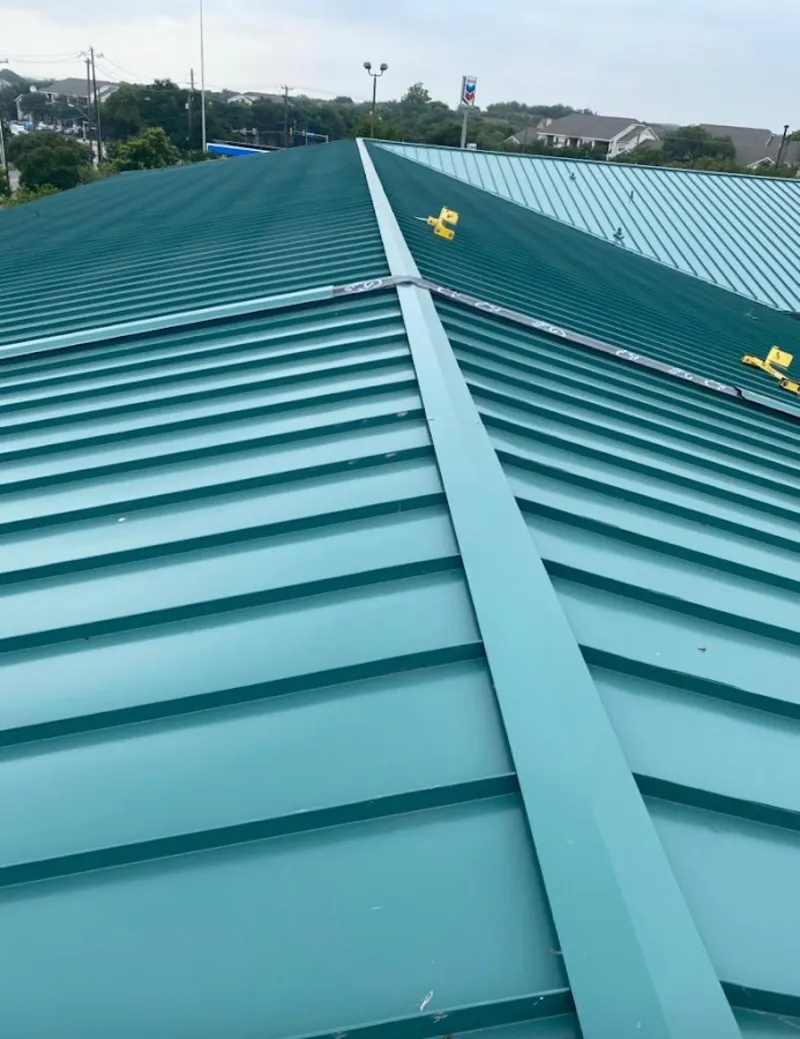 Green commercial metal roof ridge and valley for Metal Roof Repair in Ocean Pointe